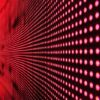 Close-up view of individual red LED pixels forming a display panel structure.