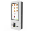 27-inch PCAP self-service kiosk displaying a fast food menu grid with integrated card payment terminal and receipt printer.