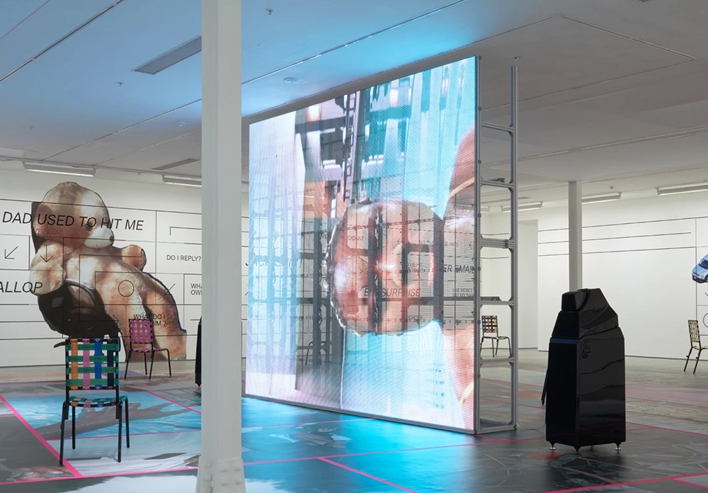 WLR Series transparent LED screen mounted on a custom freestanding frame in a gallery installation, displaying artistic video content.