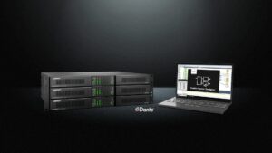 Rack-mounted Bose PowerShareX smart power amplifiers with Dante networking, shown alongside a laptop running ControlSpace Designer software.