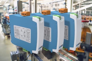 Spectra indThree DIN rail-mounted I3D signal duplicators installed in an industrial control panel, used for isolating and duplicating process signals. ustrial controls convertor for process signals