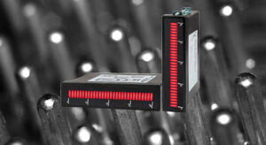 Two red LED digital bar graph displays mounted for industrial process monitoring, shown against a backdrop of metal pins.