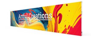 Long, narrow LED fascia display above an art supply storefront, showing vibrant paint-swirl imagery and branding.