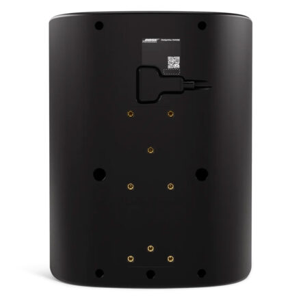 Rear panel of a matte black Bose Professional DesignMax DM12SE surface-mount loudspeaker, showing M8 threaded mounting inserts, the product QR label, and integrated installation hardware channels.